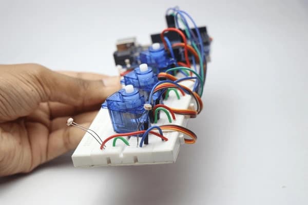 Student building circuits with Arduino microcontroller at Idaho Discovery Week electronics camp